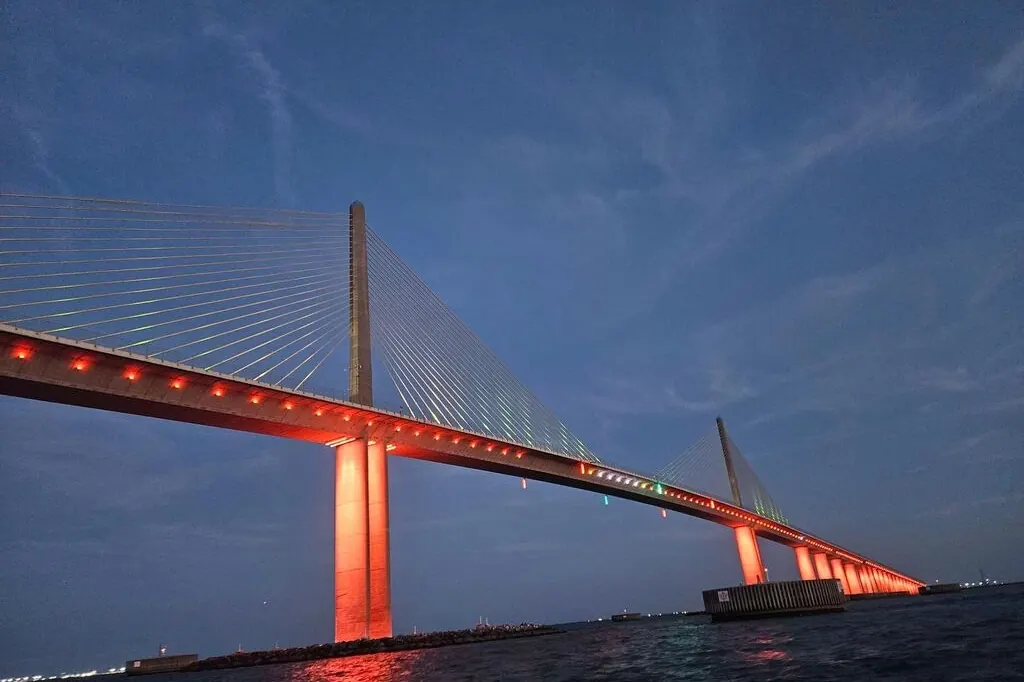 Private boat cruising toward the Sunshine Skyway Bridge near St. Pete