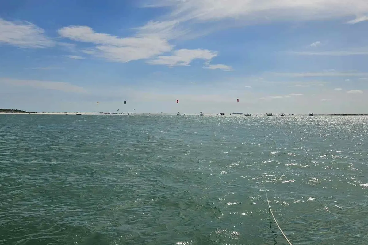 Boats anchored at a Tampa Bay sandbar on a sunny afternoon