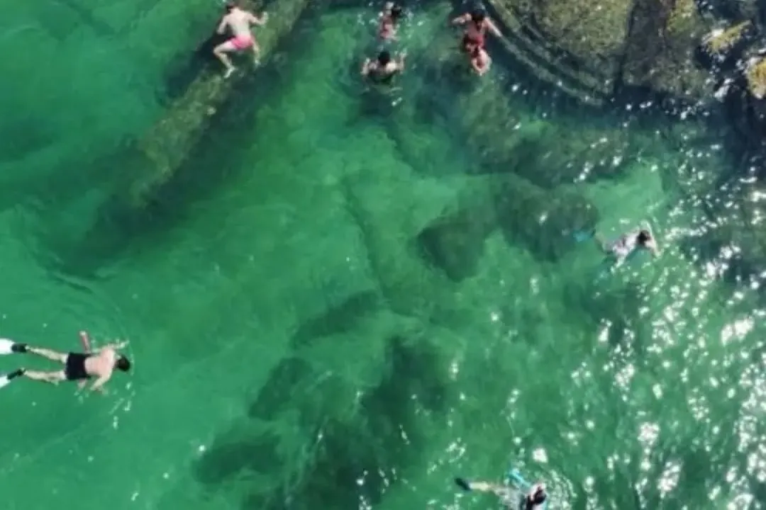 Aerial view of snorkelers swimming over the Egmont Key fort ruins