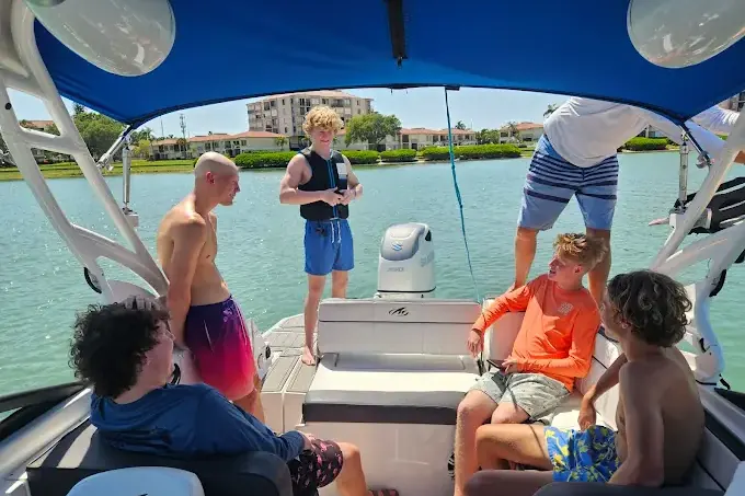 Family smiling together on a private boat near St. Petersburg