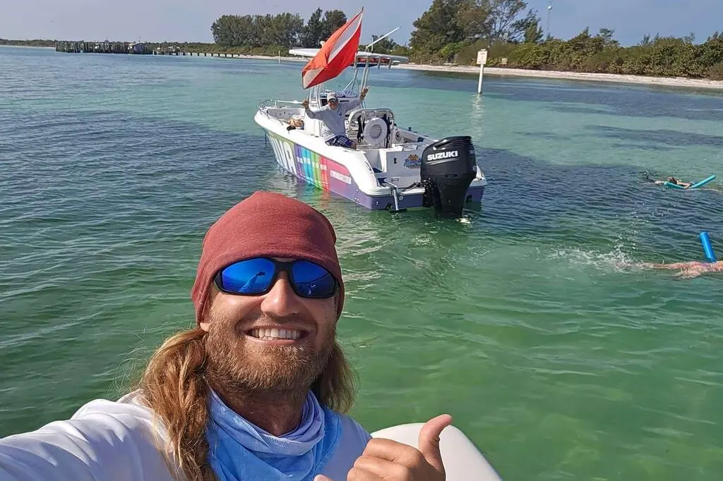 Captain at the helm of a clean private boat near Treasure Island