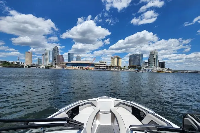 Private boat on the water with the St. Petersburg skyline behind