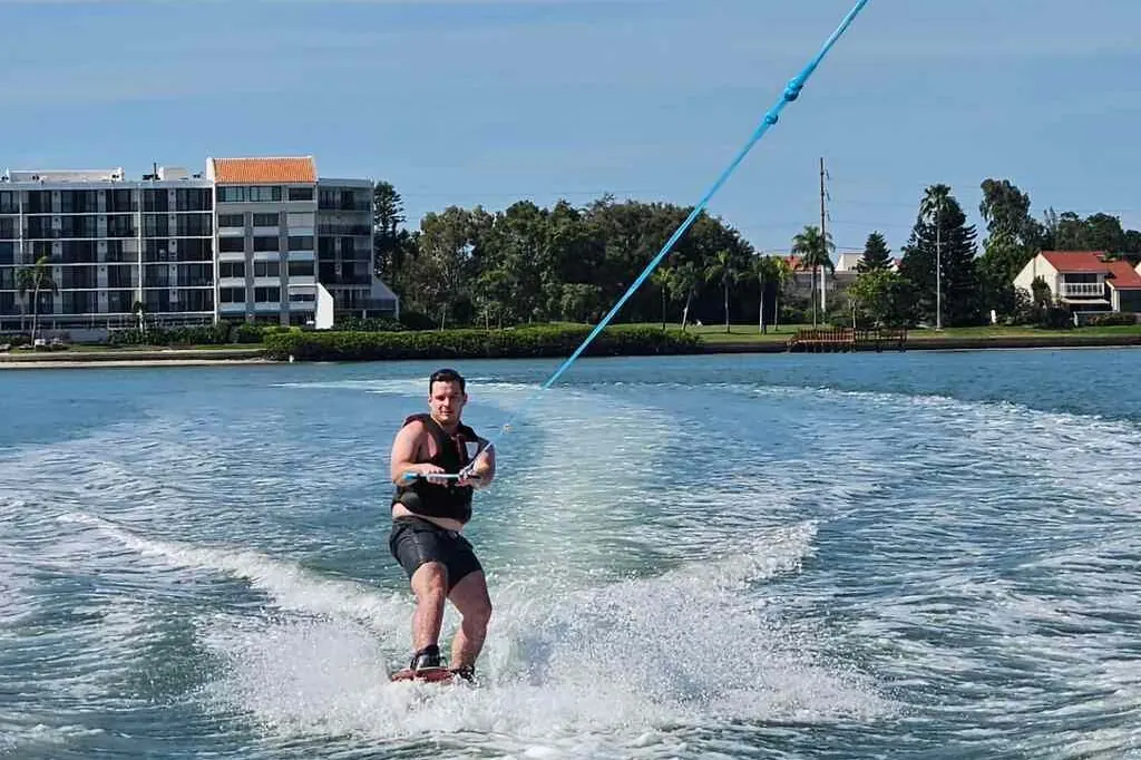 Wakeboarder carving across protected water in Gulfport