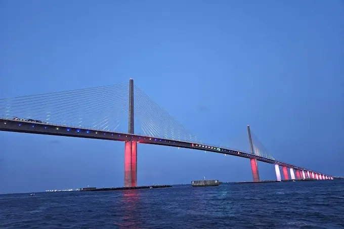 Boat cruising across Tampa Bay toward a sandbar