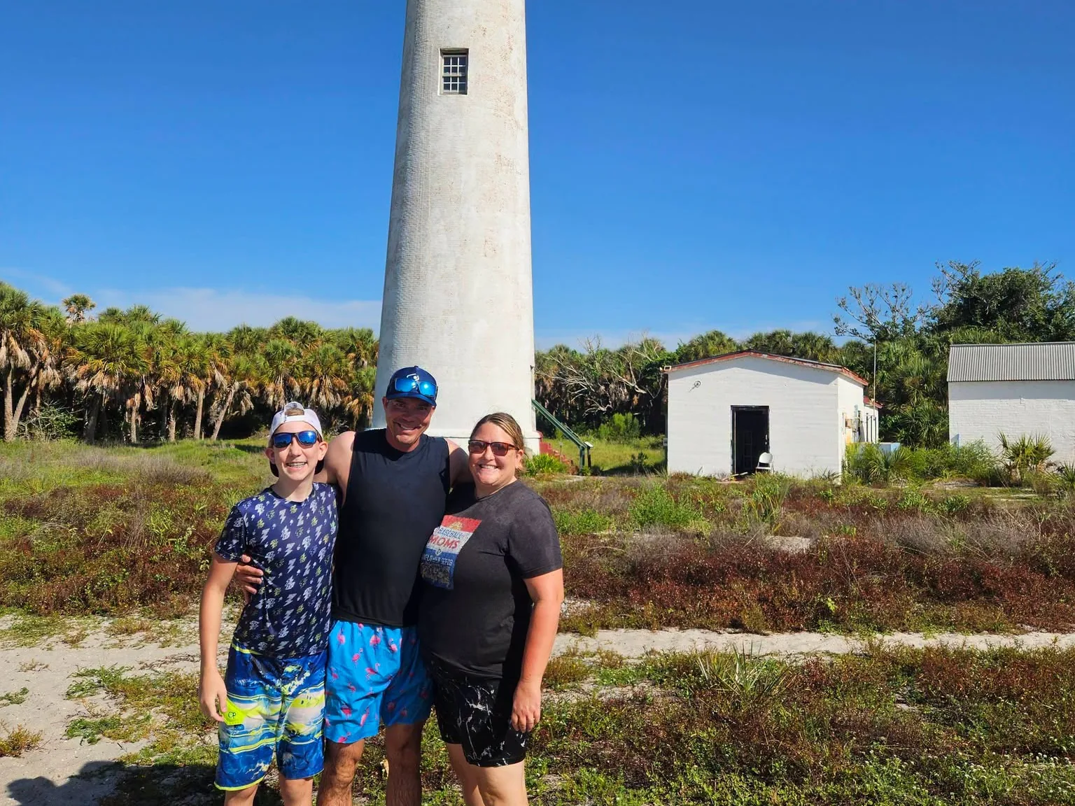 Guests in front of the Egmont Key lighthouse