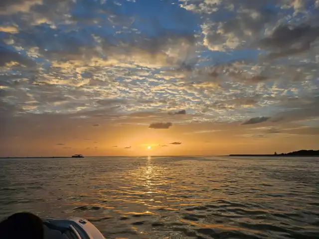 Orange sunset over the Gulf from the boat