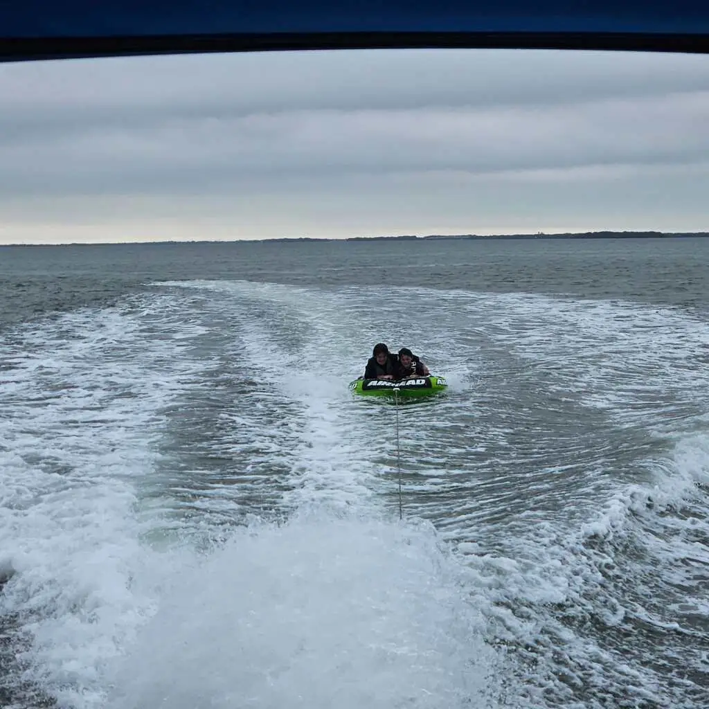 A person enjoying Snorkeling Allen's Aquatic Adventures in vibrant Gulf waters.