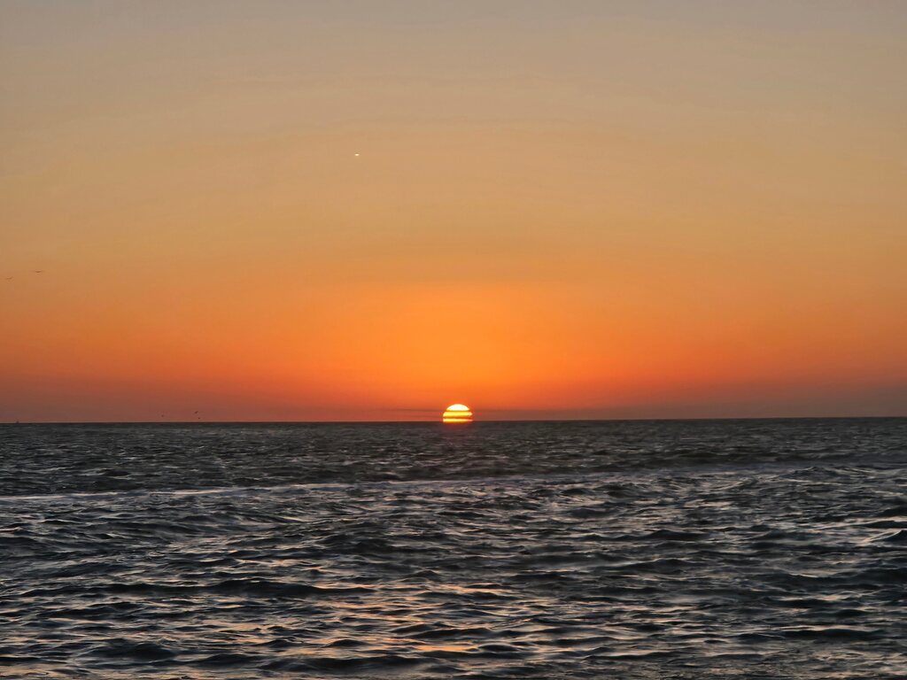 A breathtaking sunset over the water, a perfect scene for Sunset Cruises with Allen's Aquatic Adventures.