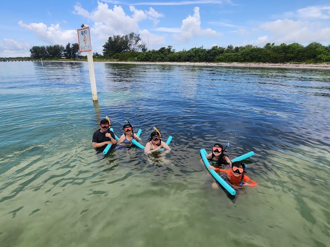 Sandbar hopping in Tampa Bay with clear water and boats enjoying Florida's best kept secret