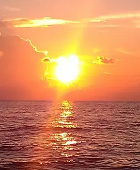 A breathtaking sunset over the water, a perfect scene for Sunset Cruises with Allen's Aquatic Adventures.