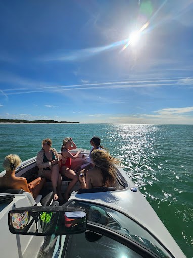 Small group enjoying a private boat tour in Largo, Florida