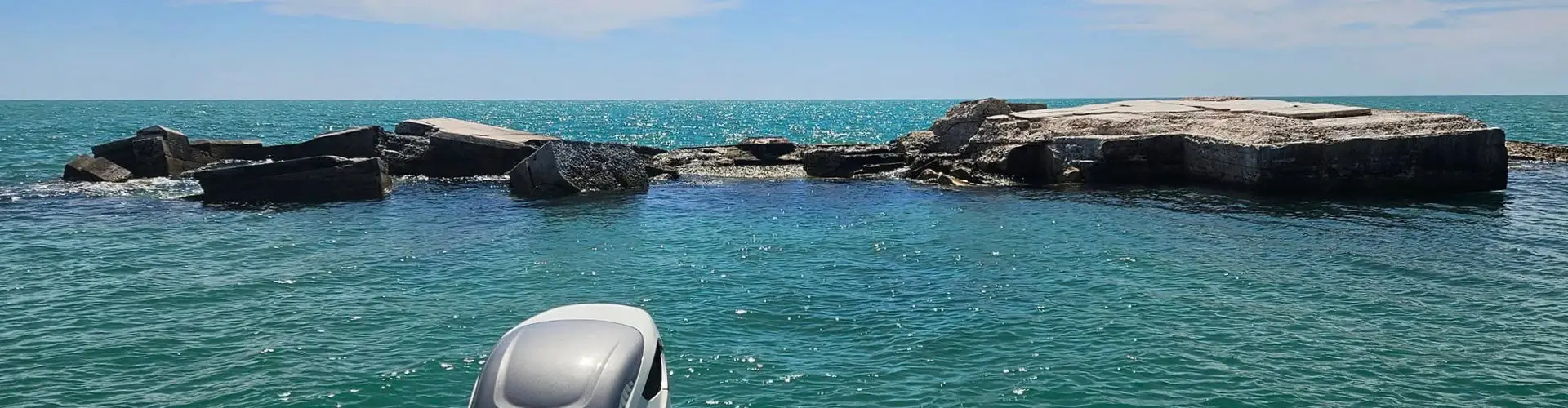 A person enjoying Snorkeling Allen's Aquatic Adventures in vibrant Gulf waters.